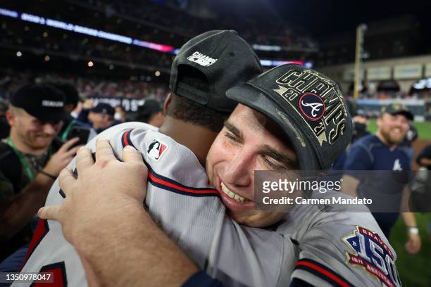 Jorge Soler and Luke Jackson of the Atlanta Braves celebrate their 7-0 victory against the Houston Astros in Game Six to win the 2021 World Series at...