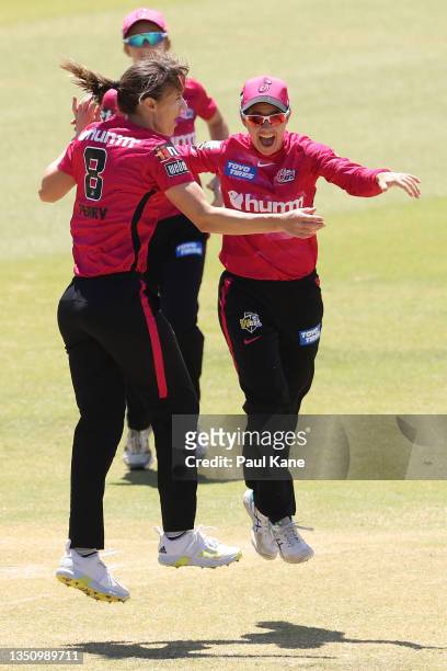 Ellyse Perry and Nicole Bolton of the Sixers celebrates the wicket of Rachel Priest of the Hurricanes during the Women's Big Bash League match...