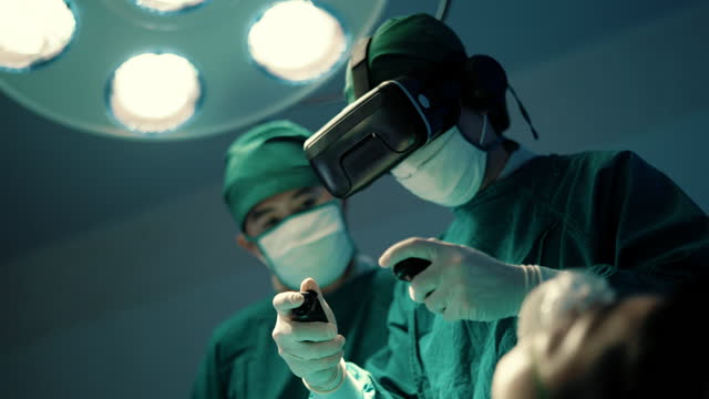 Surgeon student practicing for using VR headsets in operating room.