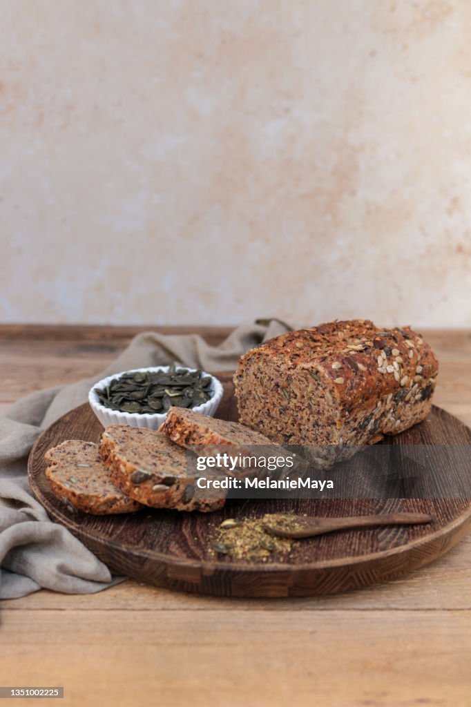 Fresh homemade brown bread loaf with whole grain and seeds