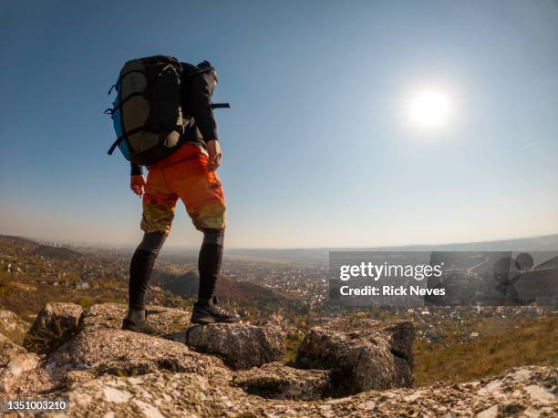 adventure man with back pack in mountain top, budapest in background - train hungary stock pictures, royalty-free photos & images