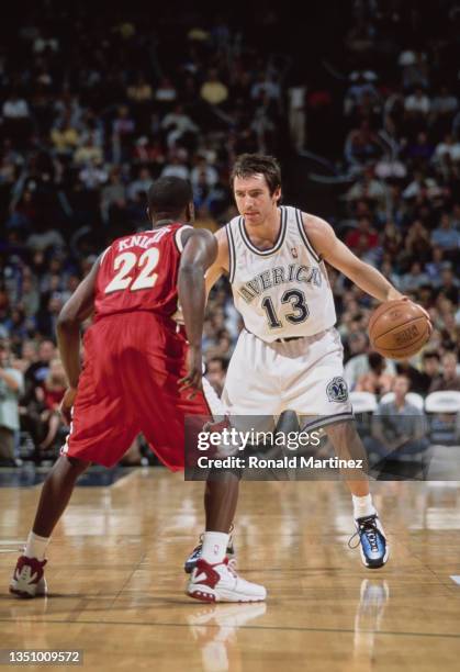 Steve Nash, Point Guard for the Dallas Mavericks dribbles the basketball down court looking at Brevin Knight of the Atlanta Hawks during their NBA...