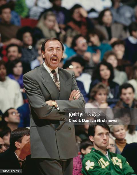 Chris Ford, Head Coach for the Boston Celtics shouts out instructions to the team from the side line during the NBA Midwest Division basketball game...