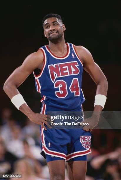 Chris Morris, Small Forward and Shooting Guard for the New Jersey Nets looks on with hands on hips during the NBA Midwest Division basketball game...