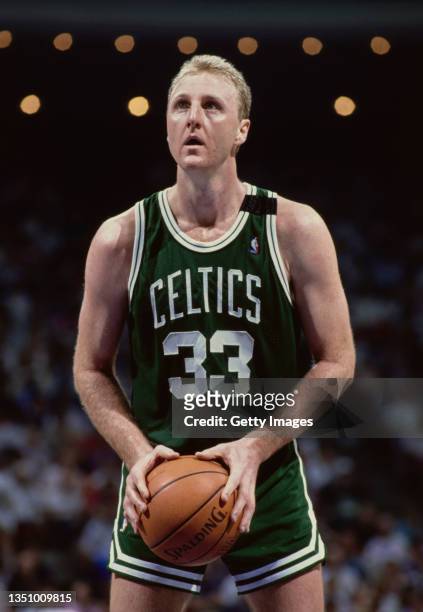 Larry Bird, Power Forward for the Boston Celtics prepares to shoot a free throw to the basket during a NBA Atlantic Division basketball game circa...