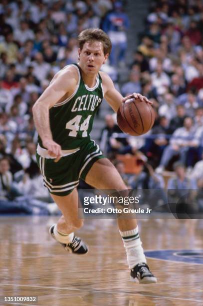 Danny Ainge, Shooting Guard and Point Guard for the Boston Celtics dribbles the basketball down court during the NBA Midwest Division basketball game...