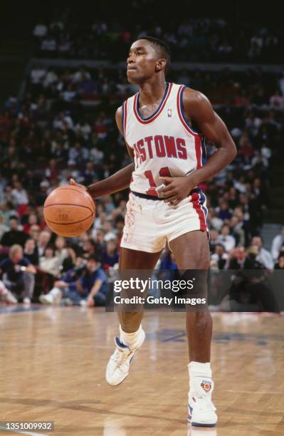 Isiah Thomas, Point Guard for the Detroit Pistons dribbles the basketball downcourt during the NBA Midwest Division basketball game against the...