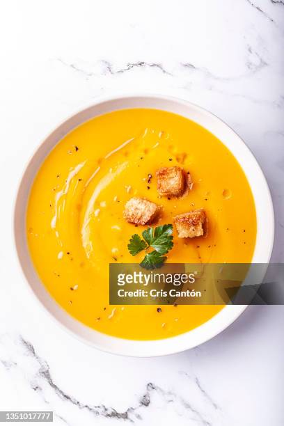 pumpkin soup on white background - pumpkin oil stock pictures, royalty-free photos & images