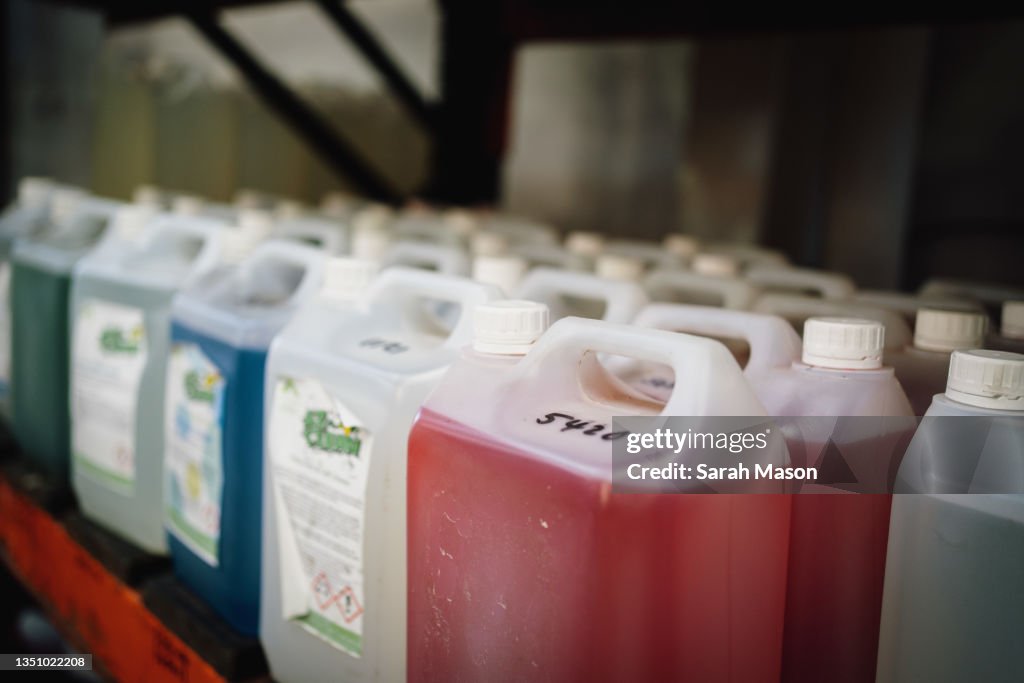 Container For Cleaner Big Plastic Containers Of Different Colour Cleaning Fluids High-Res ...