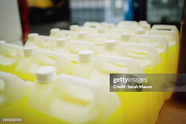 large bottles of yellow cleaning fluid - chemical manufacturing stock pictures, royalty-free photos & images