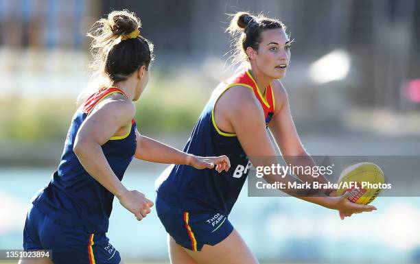 Caitlin Gould of the Crows handballs during an Adelaide Crows AFLW training session at West Lakes on November 03, 2021 in Adelaide, Australia.