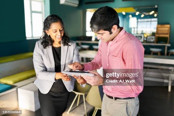 businessman signing a rental agreement with a real estate agent in an new office - signing tablet stock pictures, royalty-free photos & images