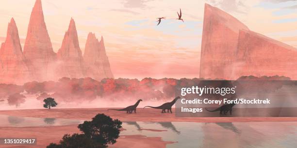 alamosaurus dinosaurs walking along a riverbank, with pterosaurs flying overhead. - alamosaurus stock illustrations