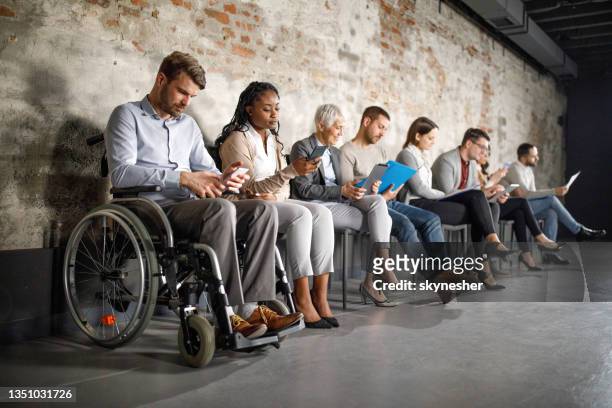 business people anticipating job interview in waiting room. - equality stock pictures, royalty-free photos & images