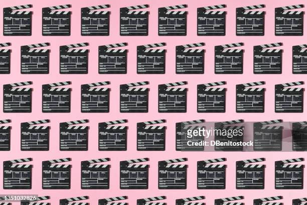 wooden old movie clapperboard pattern with hard shadow on pink background. concept of film industry, cinema, entertainment, and hollywood. - camera imagens e fotografias de stock