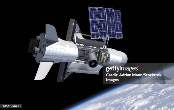 artist's concept of the x-37b spacecraft in orbit, showing payload bay and solar panels. - exploratory spacecraft stock-grafiken, -clipart, -cartoons und -symbole