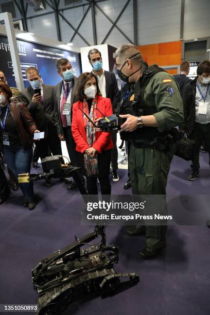 The Minister of Defence, Margarita Robles, talks with a soldier who shows her how a robot works at the International Defence and Security Fair...