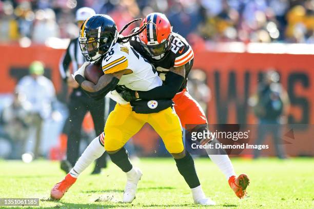 Grant Delpit of the Cleveland Browns tackles Anthony McFarland of the Pittsburgh Steelers during the second half at FirstEnergy Stadium on October...