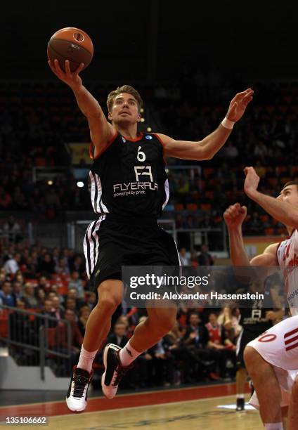 Steffen Hamann of Muenchen battles for the ball with Loukas Mavrokefalides of St. Petersburg during the Eurocup Basketball match between FC Bayern...