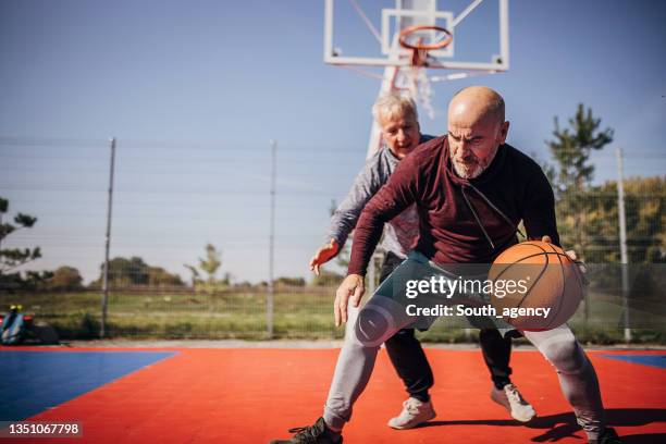 men playing basketball - old basketball hoop stock pictures, royalty-free photos & images