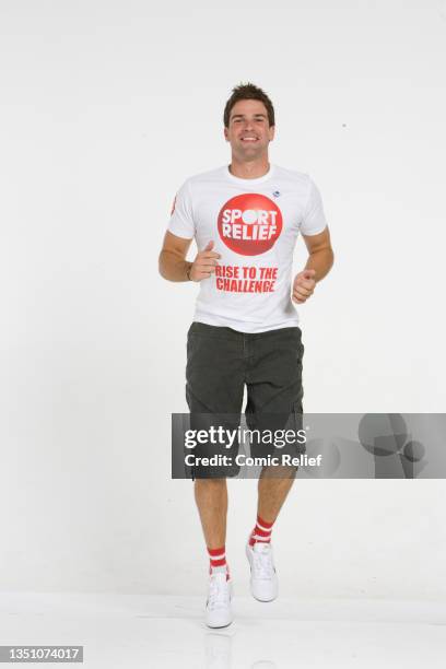 Television presenter Gethin Jones poses for a picture in a Sport Relief 'Rise to the Challenge' t-shirt and socks for Sport Relief 2008 on September...