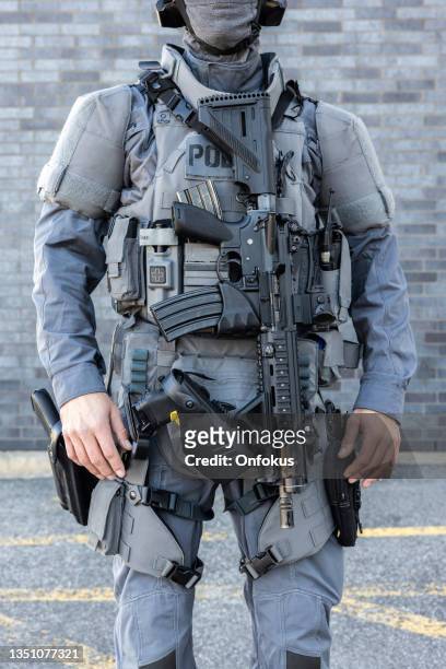 portrait of swat police officer with firearm - military uniform stock pictures, royalty-free photos & images