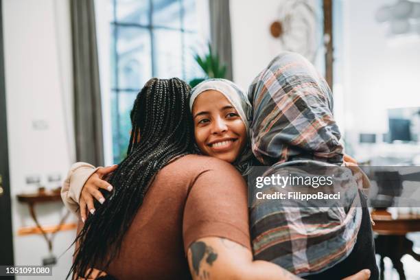 close up shot of three friends embracing each other - moroccan girls bildbanksfoton och bilder