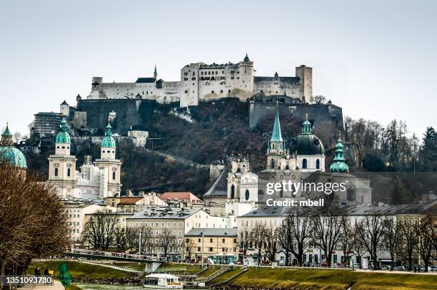 church towers of salzburg with festung hohensalzburg (high salzburg fortress) in salzburg austria - residenzgalerie stockfoto's en -beelden