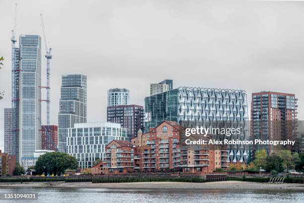 the united states embassy and surrounding newly-built apartment and commercial buildings in london - wandsworth stock pictures, royalty-free photos & images
