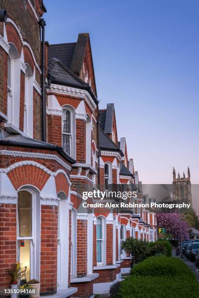 a residential street of victorian style terrace houses in london - クラパムコモン ストックフォトと画像