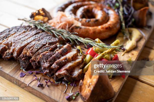 a huge platter of fresh barbeque - meat platter stock-fotos und bilder