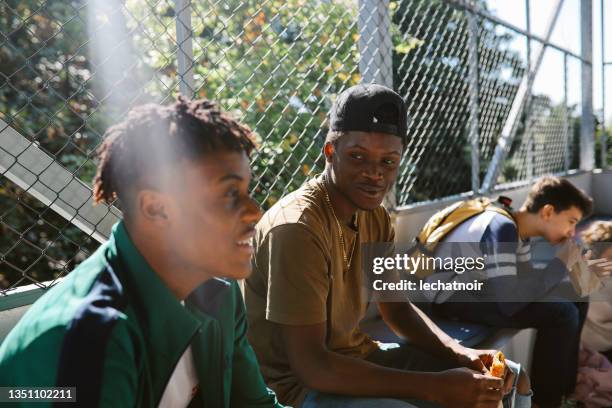 high school kids hanging out in school after classes - black teenagers stock pictures, royalty-free photos & images