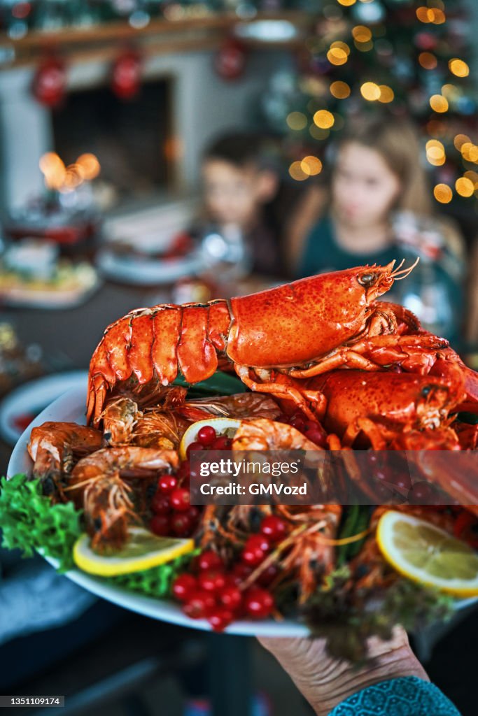 Christmas Dinner with Salmon Fish Fillet, Scallops, Lobster, Shrimps and Christmas Cake