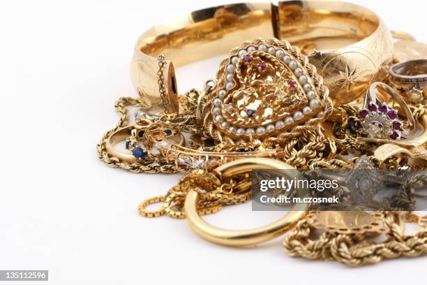 a messed up pile of gold jewelry - gold chain necklace stock pictures, royalty-free photos & images