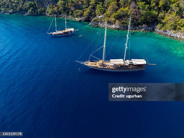 gulet boat in a beautiful bay in mediterrenian sea near göcek in turkey. - mediterranean climate stock pictures, royalty-free photos & images