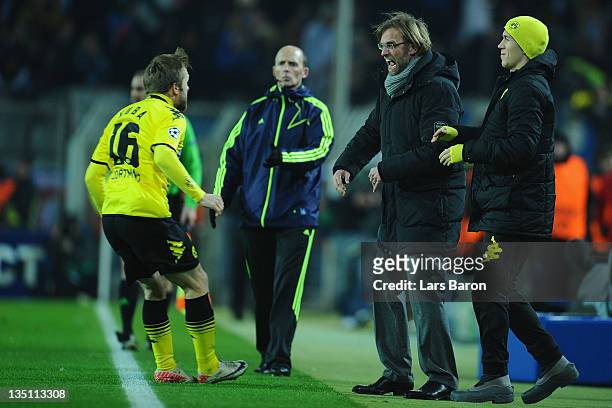 Jakub Blaszczykowski of Dortmund celebrates with head coach Juergen Klopp after scoring his teams first goal during the UEFA Champions League group F...