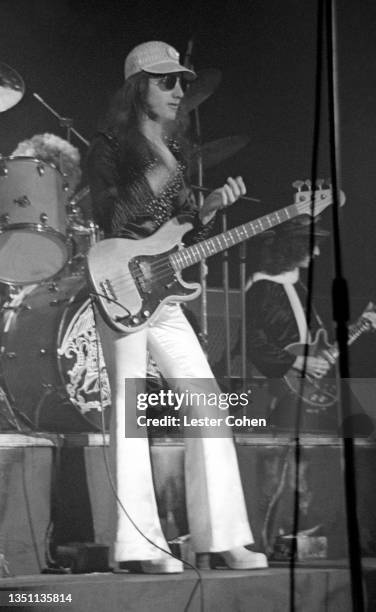 English musician and bassist John Deacon, of the British rock band Queen, plays on stage during a concert circa 1980 in Los Angeles, California.