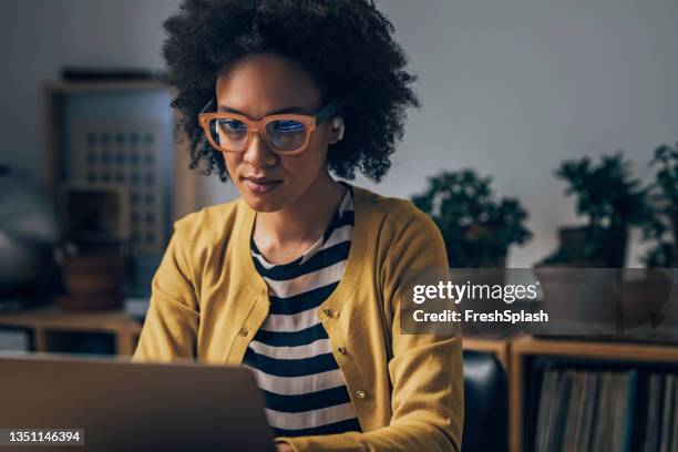 business woman using laptop computer at night - office space movie stock pictures, royalty-free photos & images