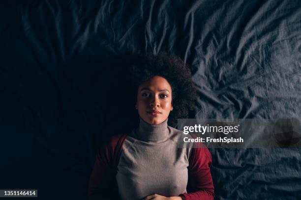 top view of a beautiful woman lying in bed - top view lying down stock pictures, royalty-free photos & images