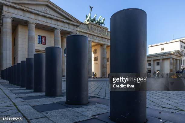 brandenburg gate with security bollards (berlin, germany) - bollard stock pictures, royalty-free photos & images
