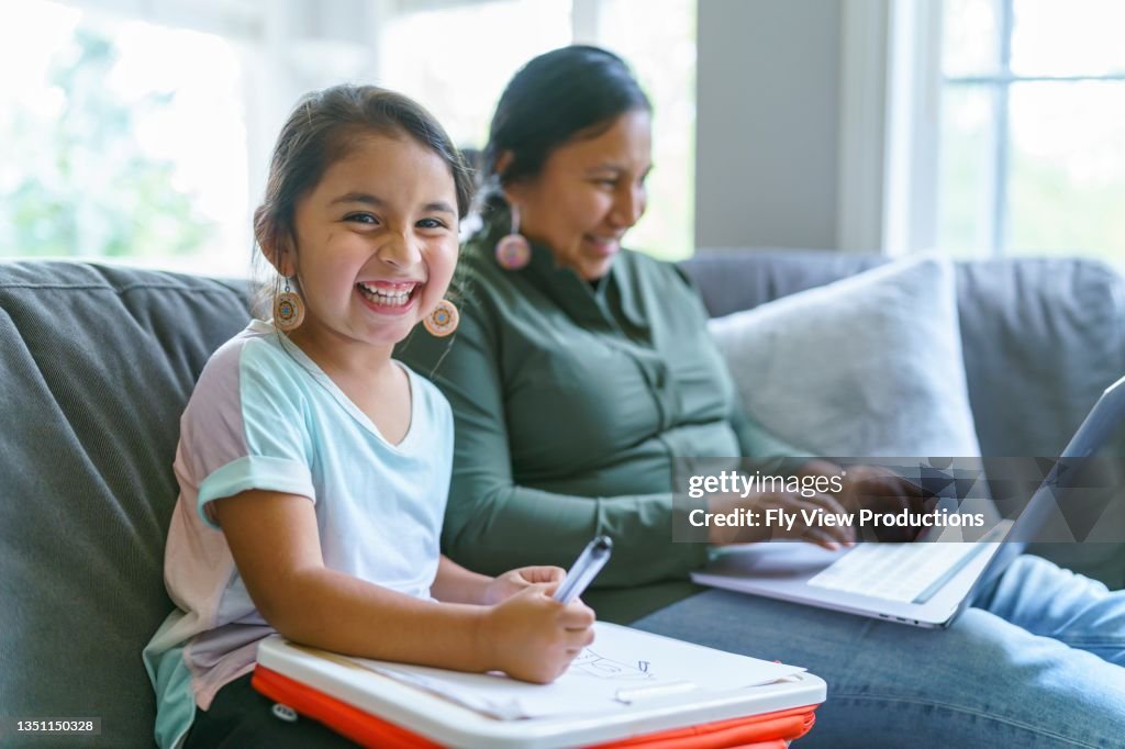 Happy Native American girl spending time with her mom