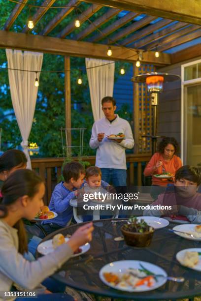 backyard bbq dinner with family and friends - chinese eating backyard stock pictures, royalty-free photos & images