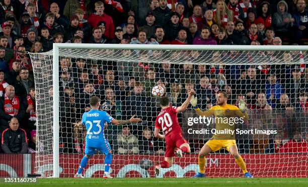 Diego Jota of Liverpool FC scores his team's first goal during the UEFA Champions League group B match between Liverpool FC and Atletico Madrid at...