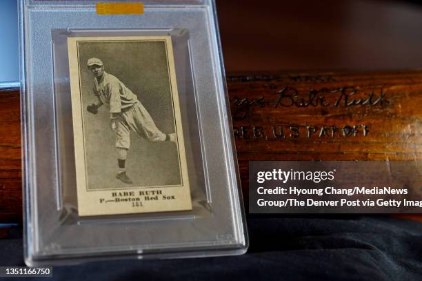 Babe Ruth baseball card, left, and 1929-30 Babe Ruth Game Used Bat at Mile High Card Company in Castle Rock, Colorado on Wednesday, November 3, 2021.