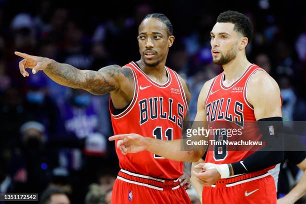 DeMar DeRozan and Zach LaVine of the Chicago Bulls speak during the first quarter against the Philadelphia 76ers at Wells Fargo Center on November...