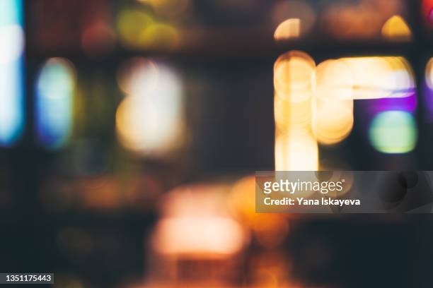 abstract defocused background of restaurant or casino neon lights indoors - street light stock pictures, royalty-free photos & images