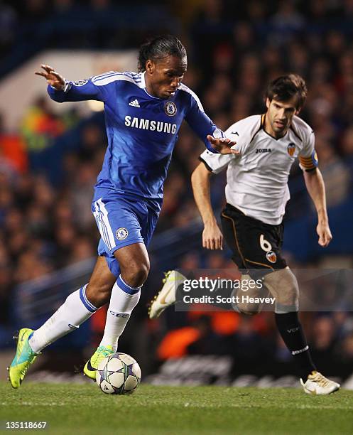 Didier Drogba of Chelsea takes on David Albelda of Valencia during the UEFA Champions League Group E match between Chelsea FC and Valencia CF at...