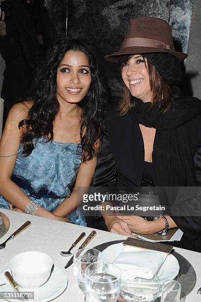 Freida Pinto and Cat Power attend the Chanel Paris-Bombay Show at Grand Palais on December 6, 2011 in Paris, France.