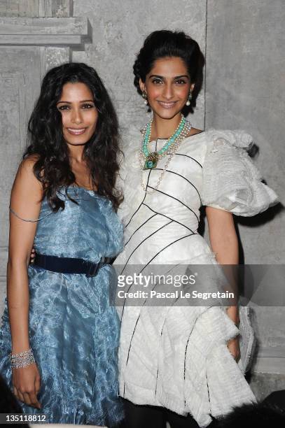 Sonam Kapoor and Freida Pinto attend the Chanel Paris-Bombay Show at Grand Palais on December 6, 2011 in Paris, France.