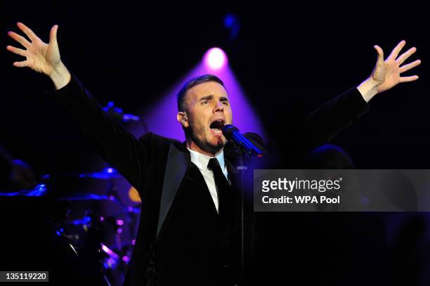 British singer-songwriter Gary Barlow performs during a fund-raising concert in aid of The Prince's Trust at Royal Albert Hall on December 6, 2011 in...